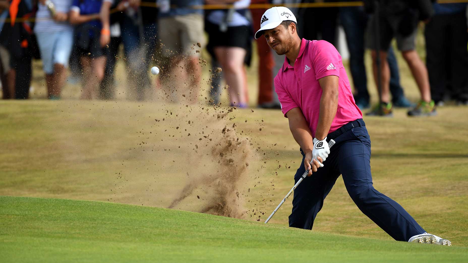 Xander Schauffele hits out of a bunker during the final round of the 2018 Open Championship.