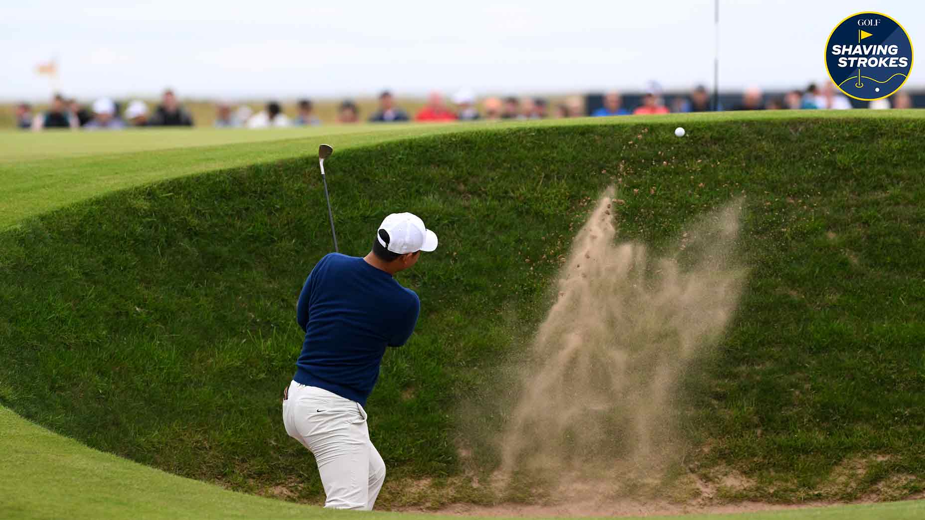 Pro golfer hits out of pot bunker at Royal Troon during Open Championship