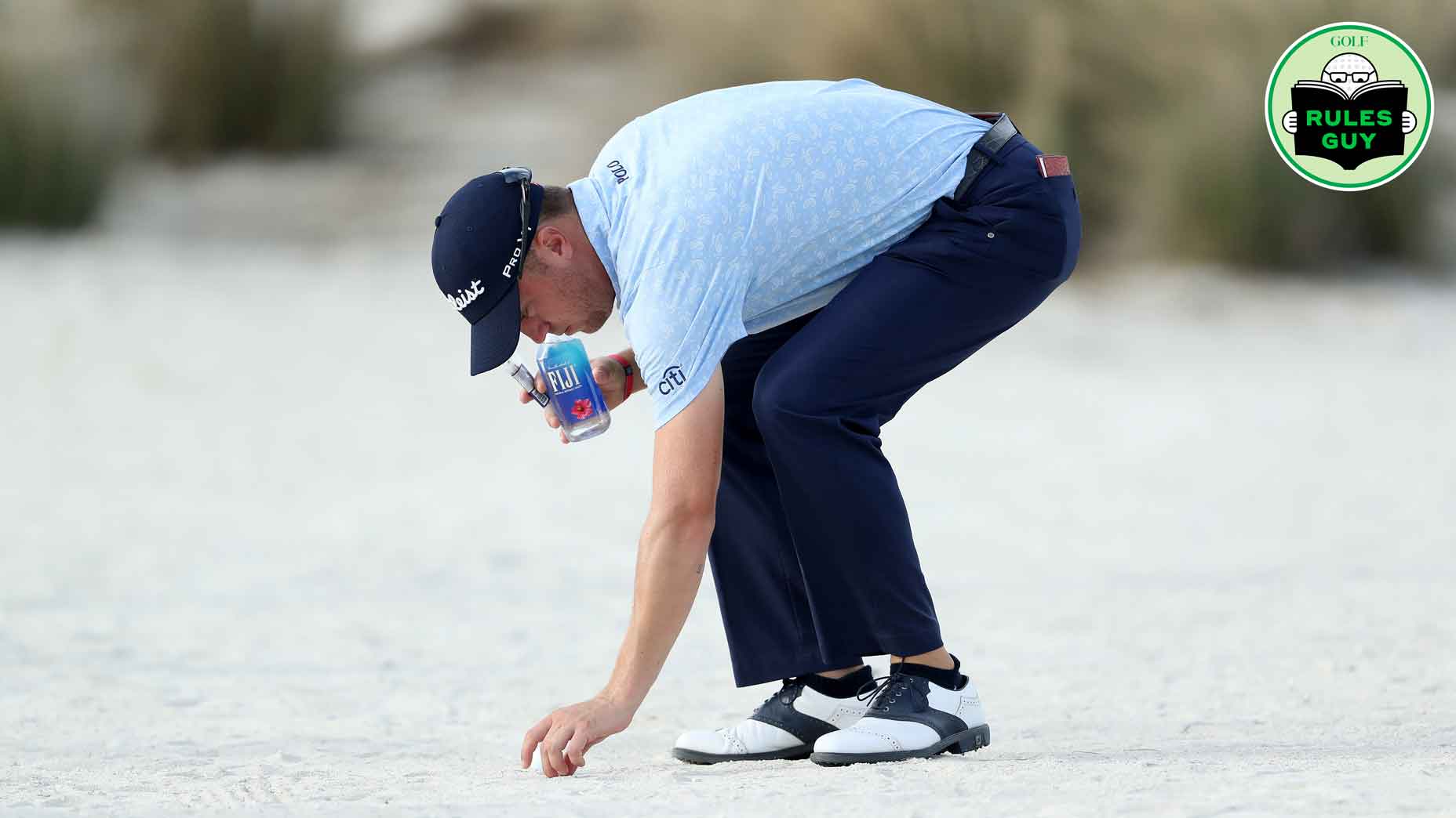 Justin Thomas of the United States removes a loose impediment before he plays his second shot on the 16th hole during the second round of the 2018 Hero World Challenge at Albany Bahamas on November 30, 2018 in Nassau, Bahamas.