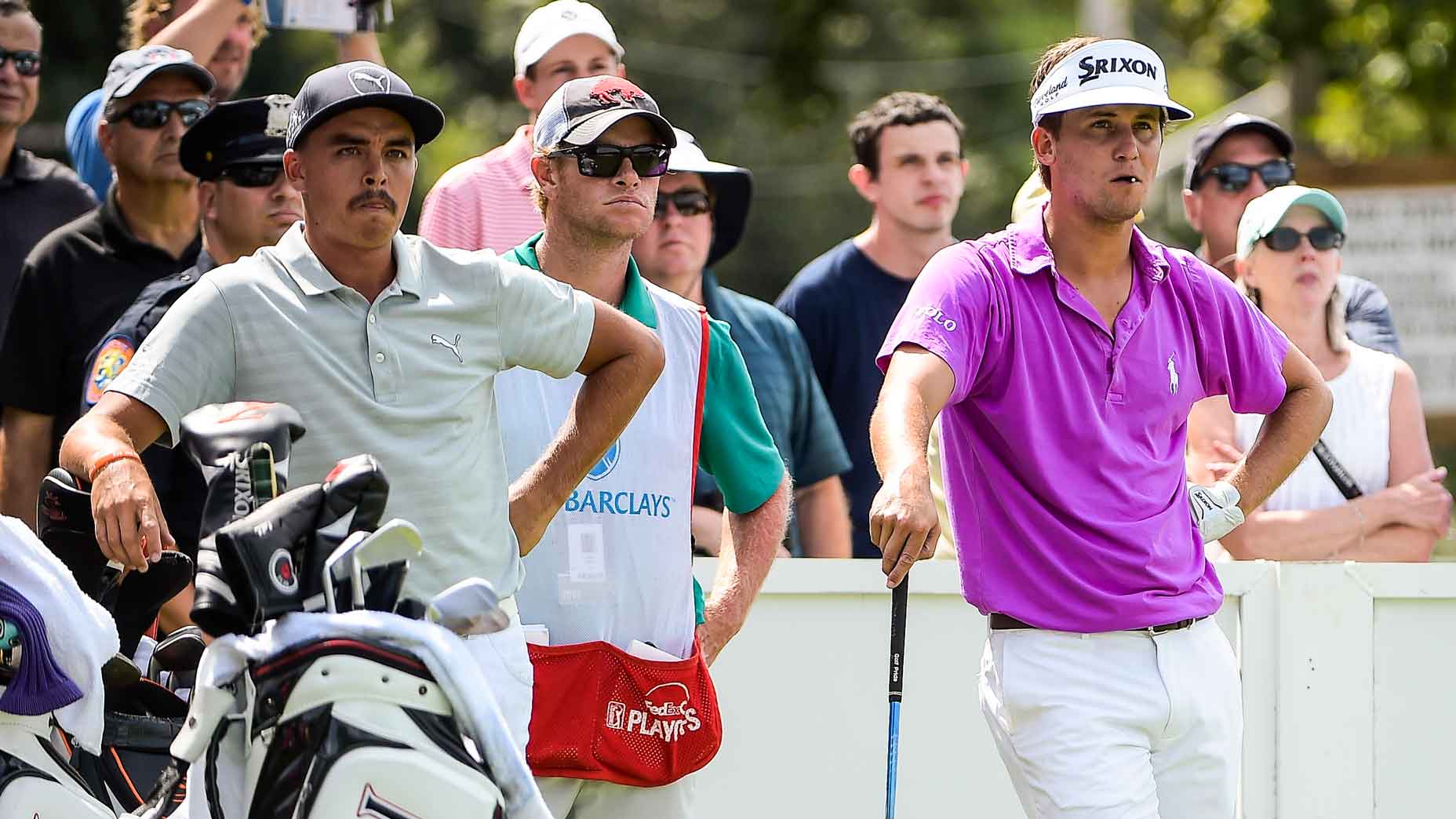 Smylie Kaufman and Rickie Fowler wait to tee off on the 15th hole during the first round of The Barclays at Bethpage State Park (Black) on August 25, 2016 in Farmingdale, New York.