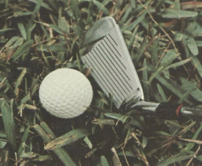 club next to ball in propped up lie