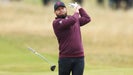 Tyrrell Hatton drops a club after a swing at the Open.