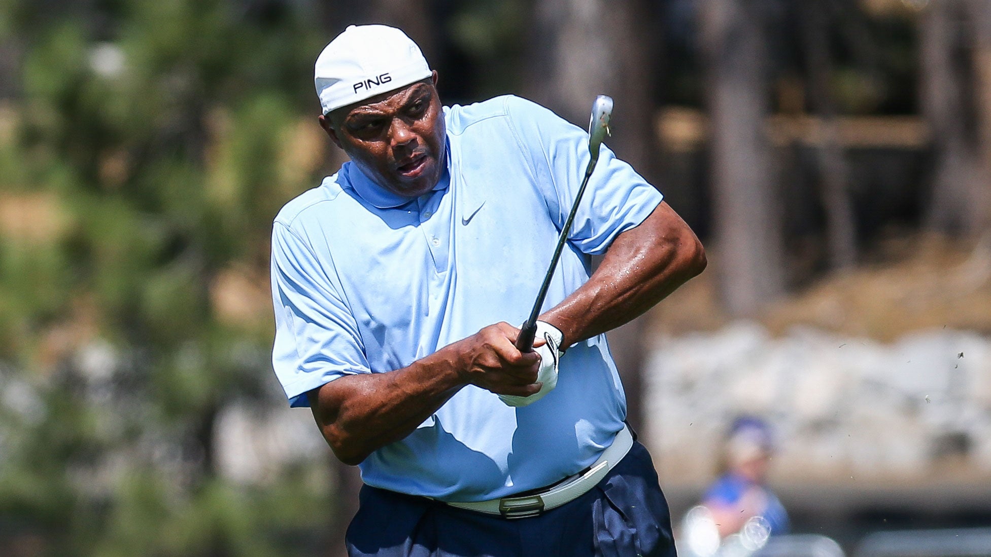 Former NBA basketball player and sports analyst Charles Barkley hits his shot on the 18th hole on day one of the 2024 American Century Championship