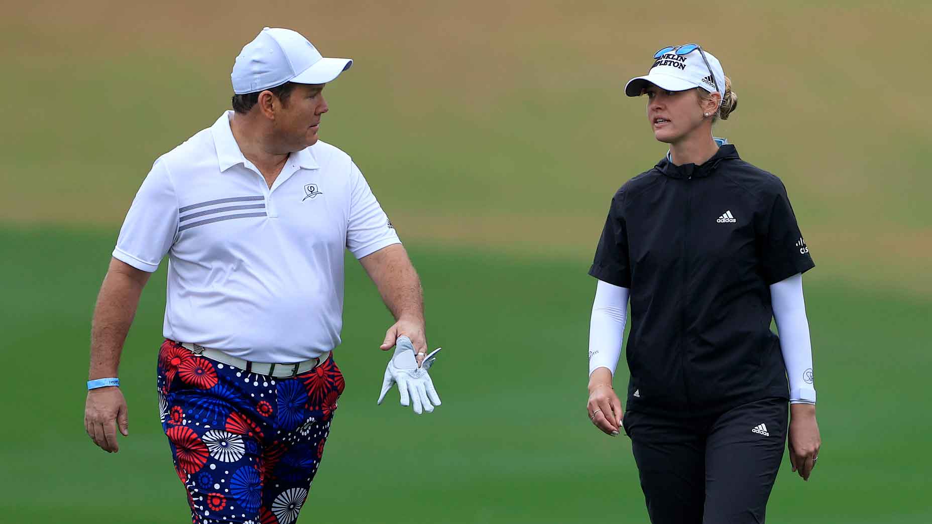 Bret Baier of Fox News and Jessica Korda walk down the fourth hole during the third round of the Diamond Resorts Tournament Of Champions at Tranquilo Golf Course at the Four Seasons Golf and Sports Club on January 23, 2021 in Lake Buena Vista, Florida.