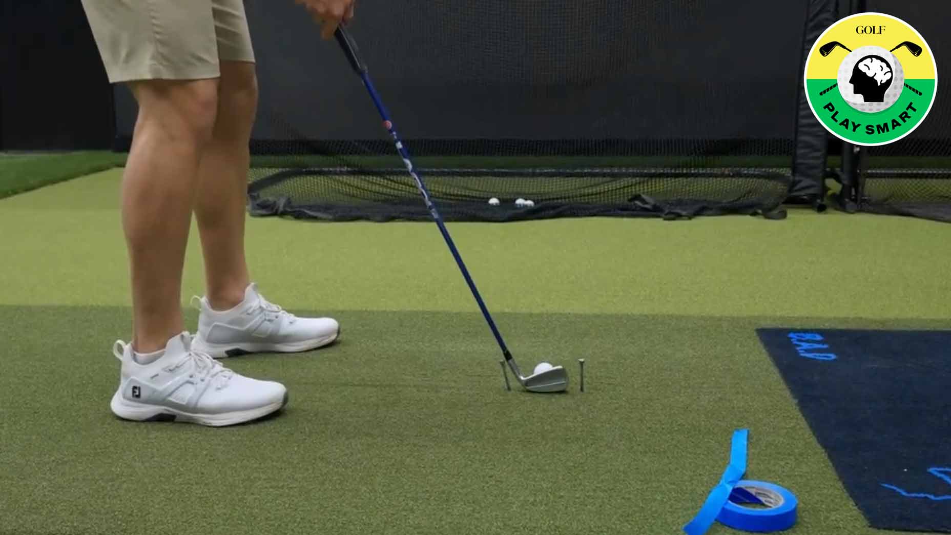 bryson dechambeau sets up two tees on either side of his clubface