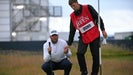 Daniel Brown and his caddie and brother Ben read putt at 2024 Open Championship