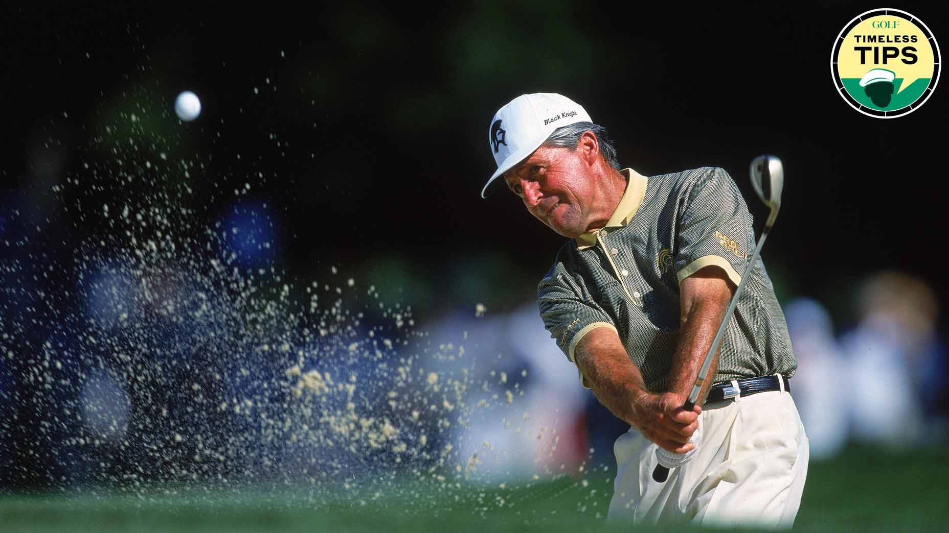 Pro golfer gary player hits a ball from a bunker