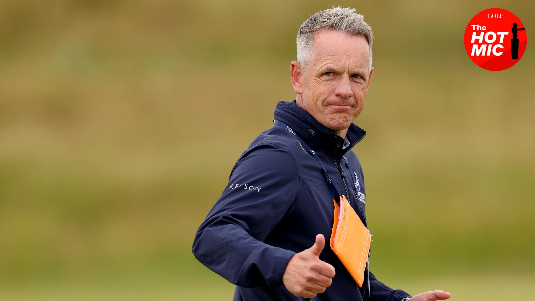 Luke Donald gives thumbs up at open championship in navy jacket