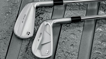 taylormade p-series irons p7cb p770 on a wet wood deck