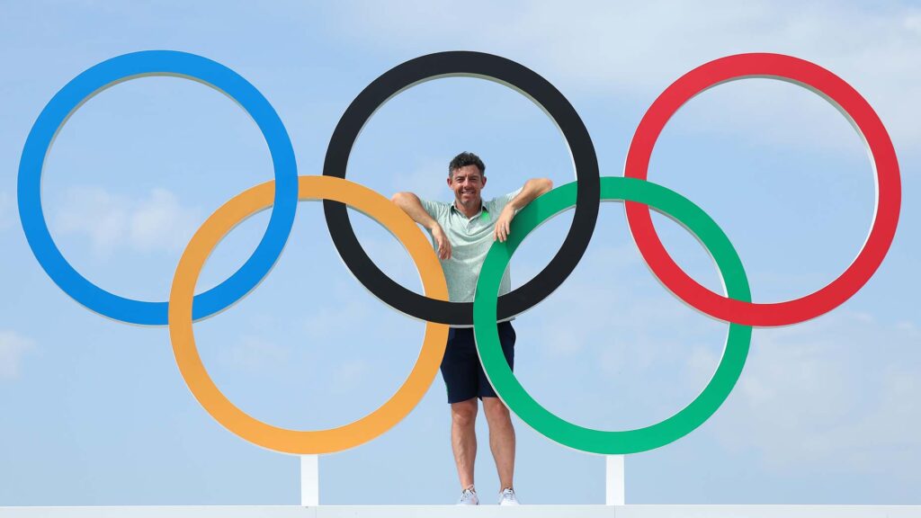 Pro golfer Rory McIlroy poses with Olympic rings at Le Golf National