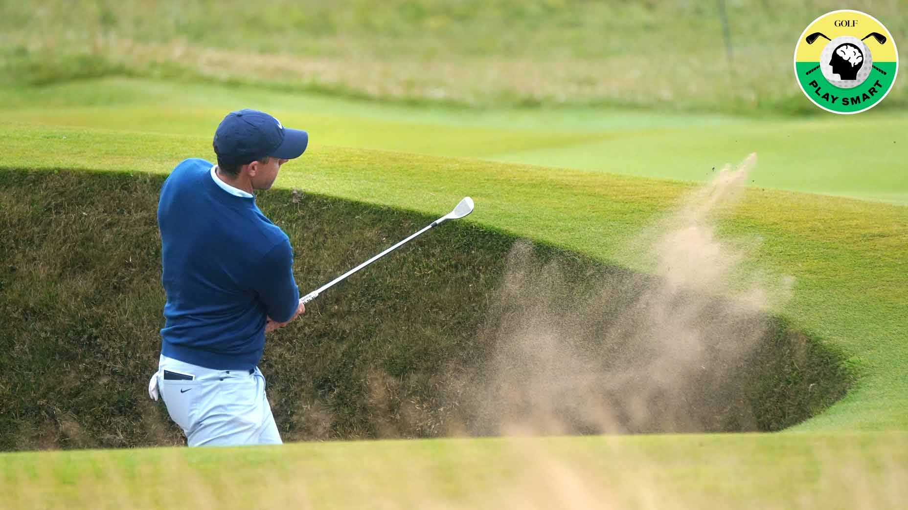 Pro golfer rory mcilroy hits a shot from a pot bunker during a practice round for the 2024 open championship