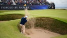 Scottie Scheffler of the United States plays a shot from a greenside bunker on the fifth hole on day four of The 152nd Open championship