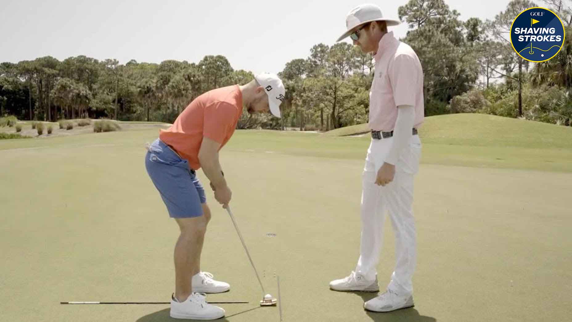 GOLF Instruction Editor Nick Dimengo works with instructor Jackson Koert on a difficult drill that helps identify proper putting aim