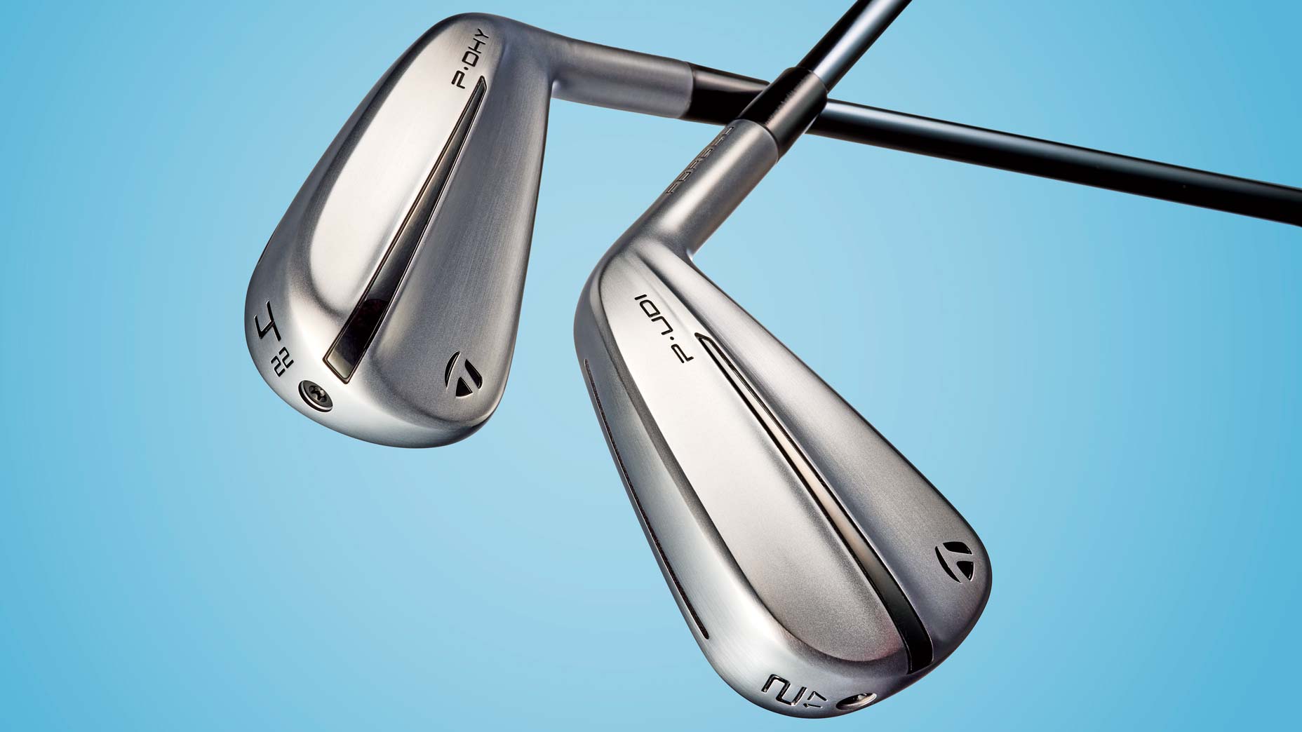 TaylorMade's new P·UDI and P·DHY utility irons against a blue background