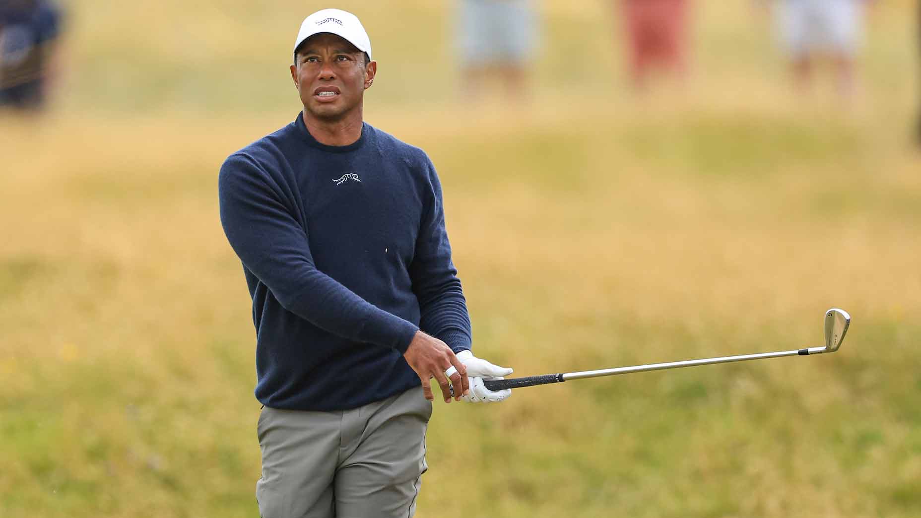 tiger woods hits a shot with an iron during round 2 of the 2024 open championship