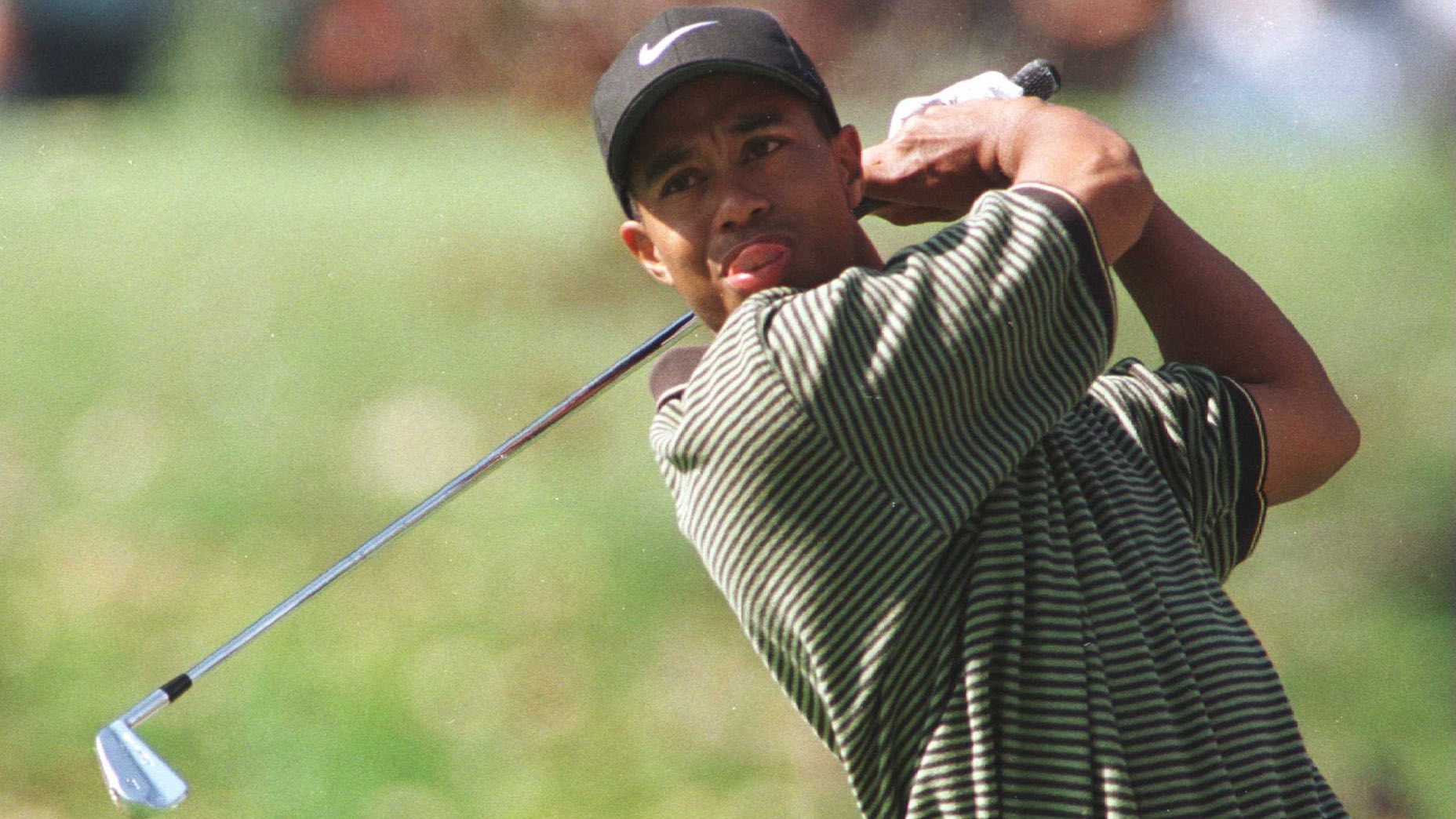 tiger woods hits a shot during a pro tournament in 1996 equipment