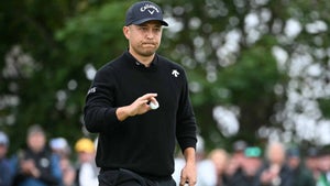 xander schauffele waves to the crowd during the final round of the 2024 open championship