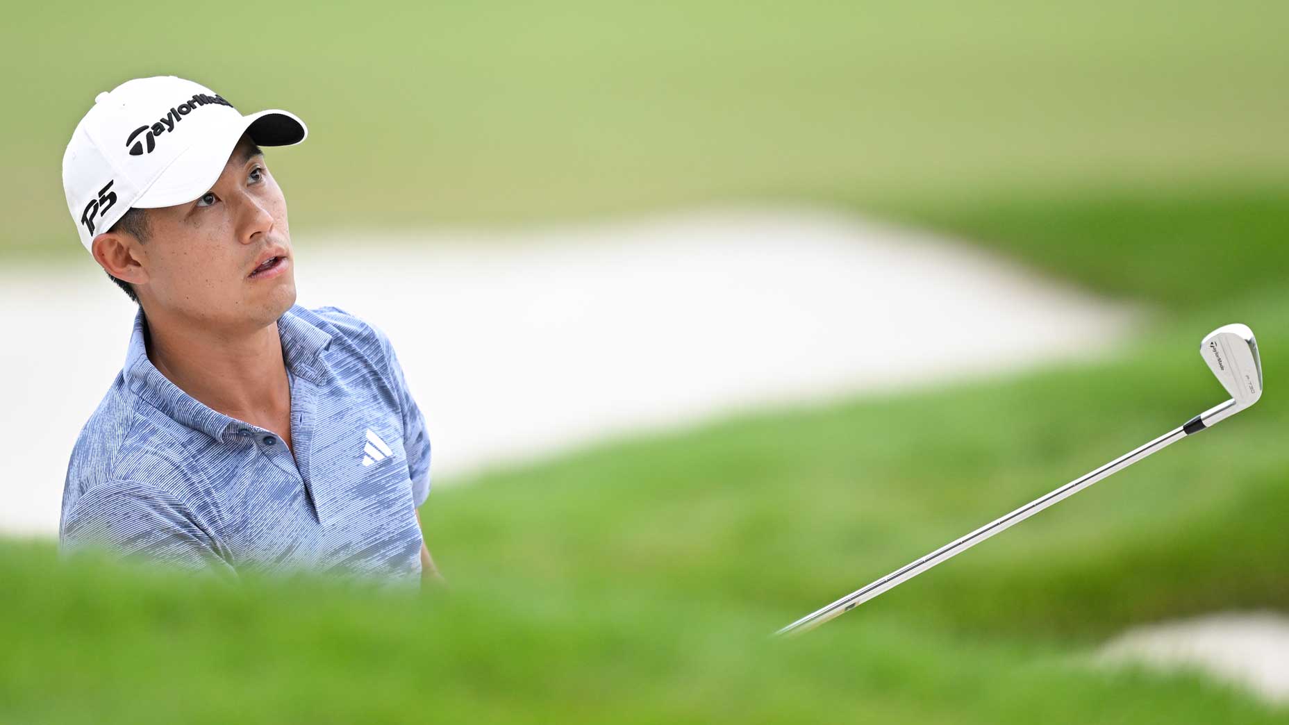 Collin Morikawa watches a bunker shot at East Lake.