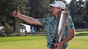 Nick Dunlap takes a selfie with the trophy at the Barracuda Championship.