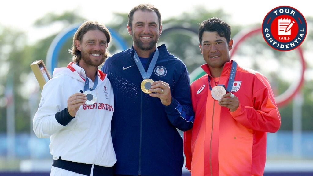 Scottie Scheffler, Tommy Fleetwood and Hideki Matsuyama pose with their Olympic medals.