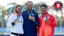 Scottie Scheffler, Tommy Fleetwood and Hideki Matsuyama pose with their Olympic medals.