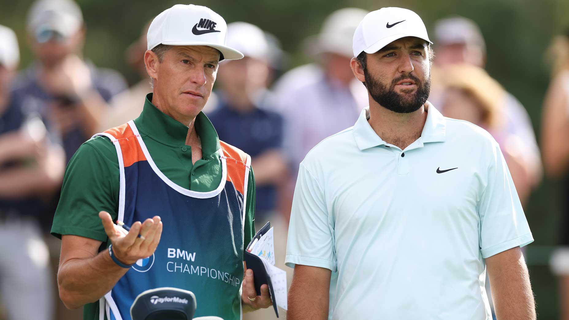 Scottie Scheffler talks with caddie Ted Scott at the BMW Championship.