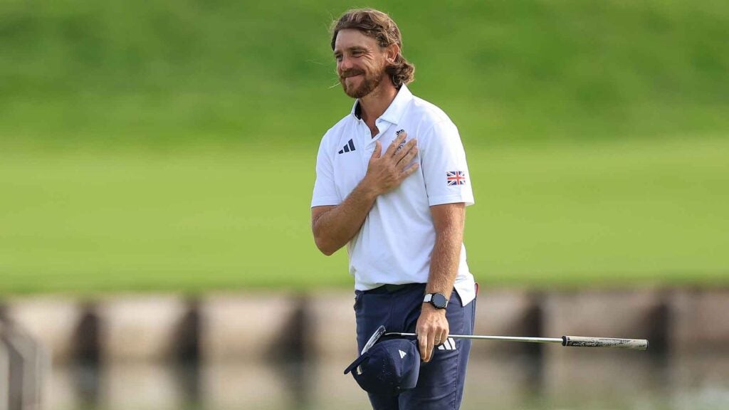 Tommy Fleetwood of England and the Great Britain Team acknowledges the crowd on the 18th hole on day nine of the Olympic Games Paris 2024 at Le Golf National on August 04, 2024 in Paris, France.