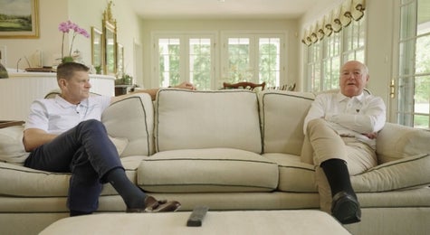 chip and gordon brewer sitting on couch