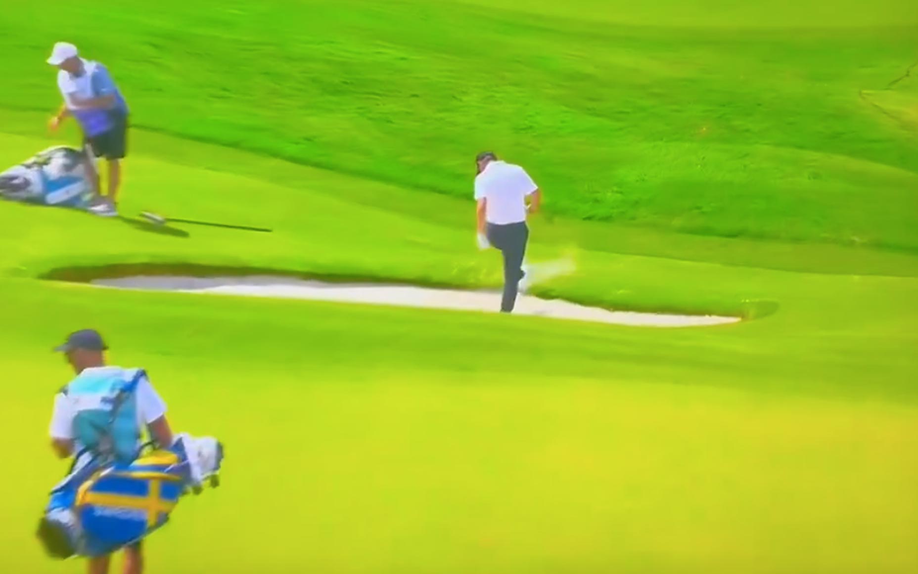 Pro golfer Emilino Grillo swings a club into a bunker Friday at the 2024 Olympics.