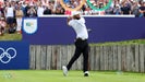 Pro golfer Jon Rahm hits drive at 2024 Olympics