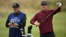 Justin Rose talks with caddie before shot at 2024 Open Championship.
