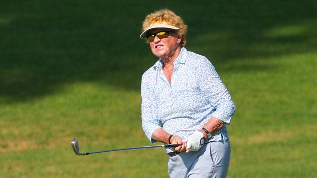 Caption JoAnne Carner hits her tee shot on the ninth hole during a practice round ahead of the 2024 U.S. Senior Women's Open at Fox Chapel Golf Club