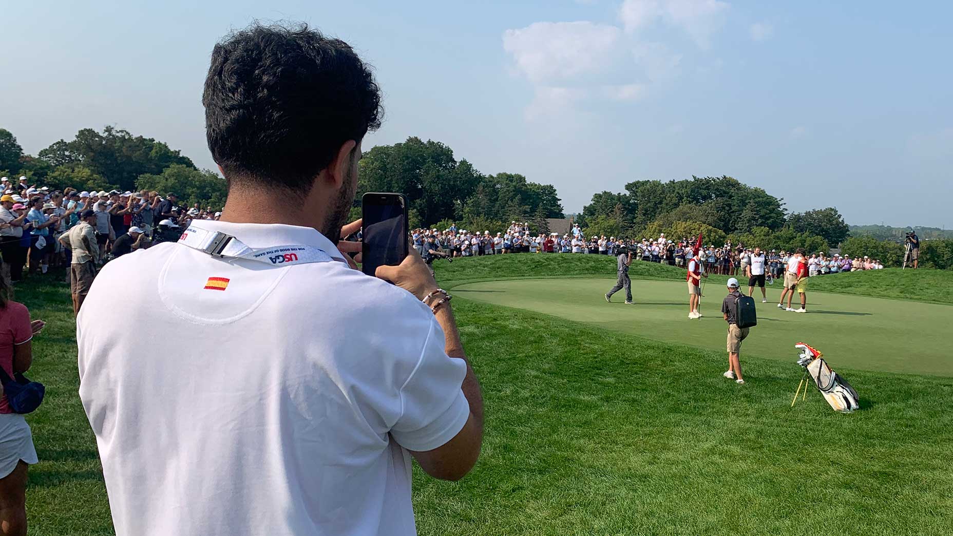 Navid Mousavi watches his friend Jose Luis Ballester's winning U.S. Amateur moment.