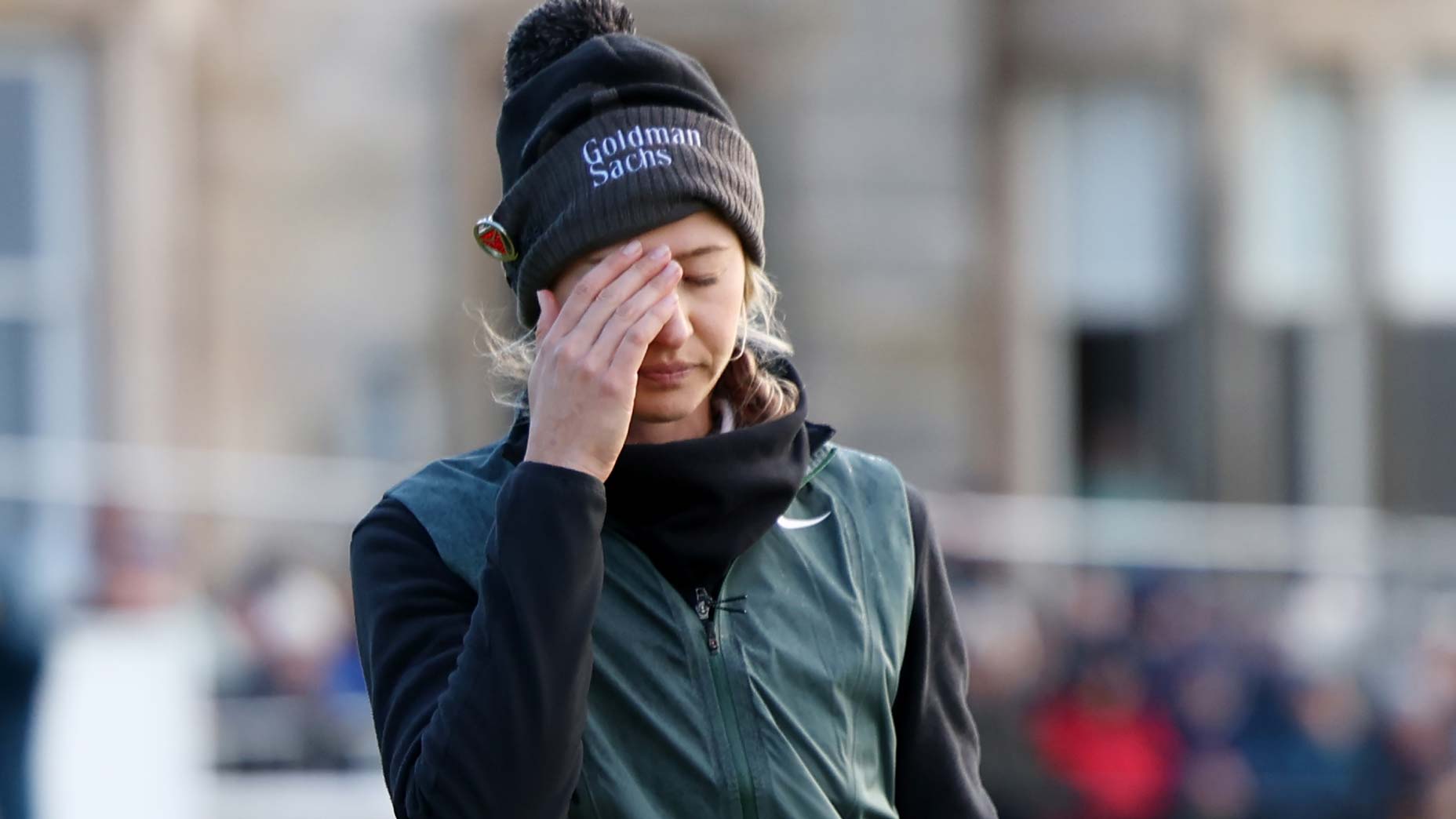 Nelly Korda covers face following her final-round 72 at the 2024 AIG Women's Open.