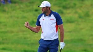 American Scottie Scheffler fist pumps in round 4 of the men's golf individual stroke play of the Paris 2024 Olympic Games at Le Golf National.