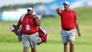 Sepp Straka walks with his caddie on the third hole during a practice round at the 2024 Olympics.
