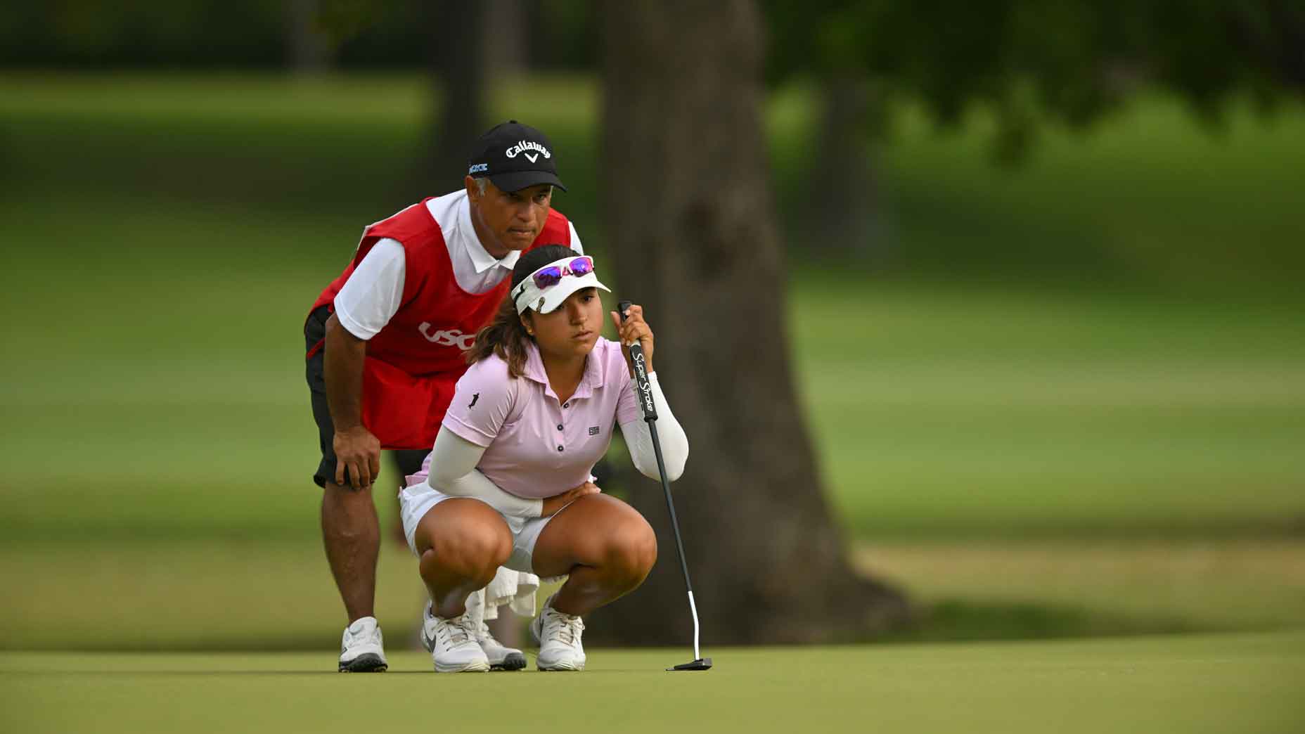 Maria Jose Marin and caddie/father, Jose Marin, read a putt on the third hole green during the semifinals of the 2024 U.S. Women's Amateur at Southern Hills Country Club in Tulsa, Okla. on Saturday, Aug. 10, 2024. (Kathryn Riley/USGA)