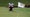 The CJ Cup Byron Nelson logo is displayed on the 121th green flag with Doug Ghim (USA) in the background lining up a putt during the first round of the PGA CJ Cup Byron Nelson on May 2, 2024, at TUP Craig Ranch in McKinney, TX.