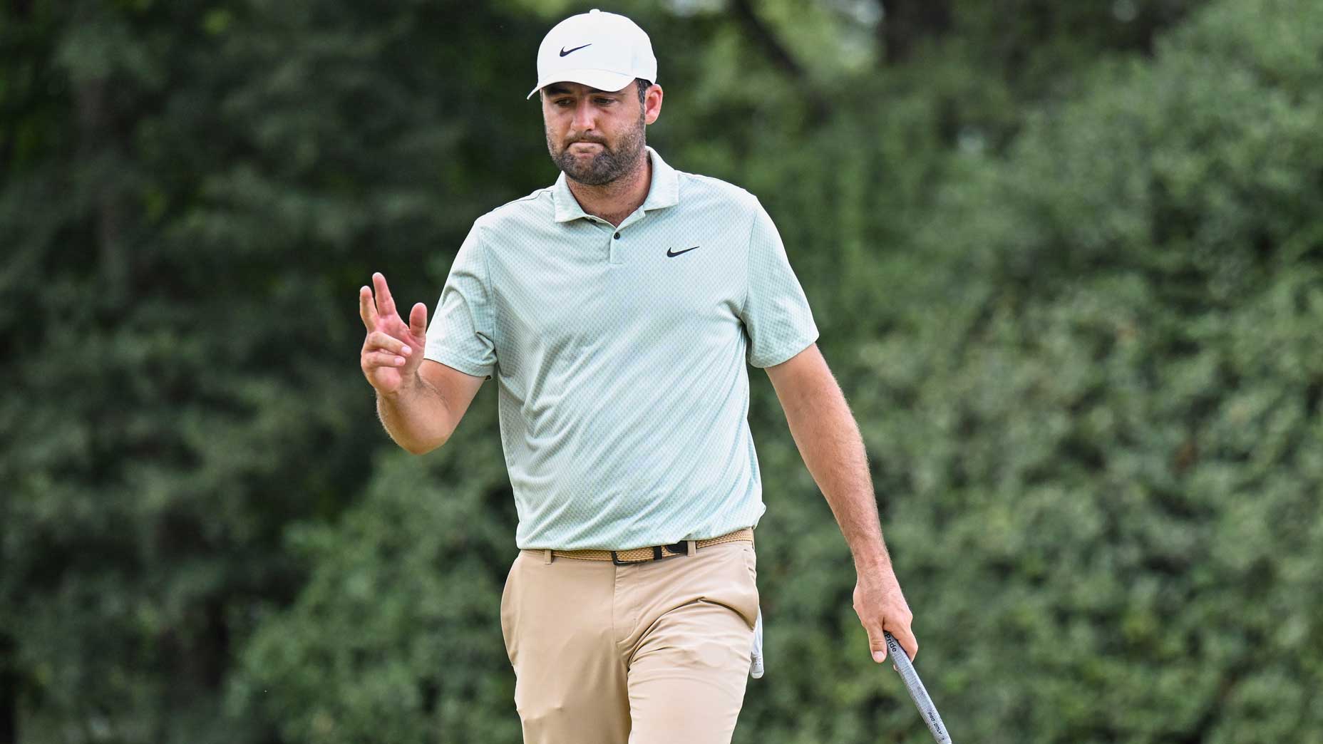 Scottie Scheffler waves after making a birdie putt at the Tour Championship.