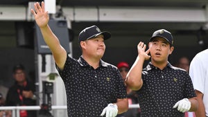 Sungjae Im of the the International Team and Tom Kim of the International Team react to the crowd on the first tee during Four-Ball on day one of the 2024 Presidents Cup at The Royal Montreal Golf Club on September 26, 2024 in Montreal, Quebec. (