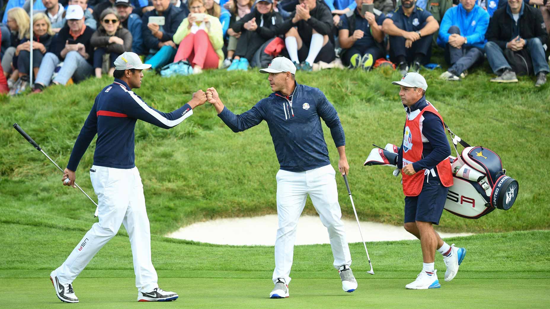 US golfer Brooks Koepka (R) and US golfer Tony Finau celebrate during their fourball match on the first day of the 42nd Ryder Cup at Le Golf National Course at Saint-Quentin-en-Yvelines, south-west of Paris on September 28, 2018.