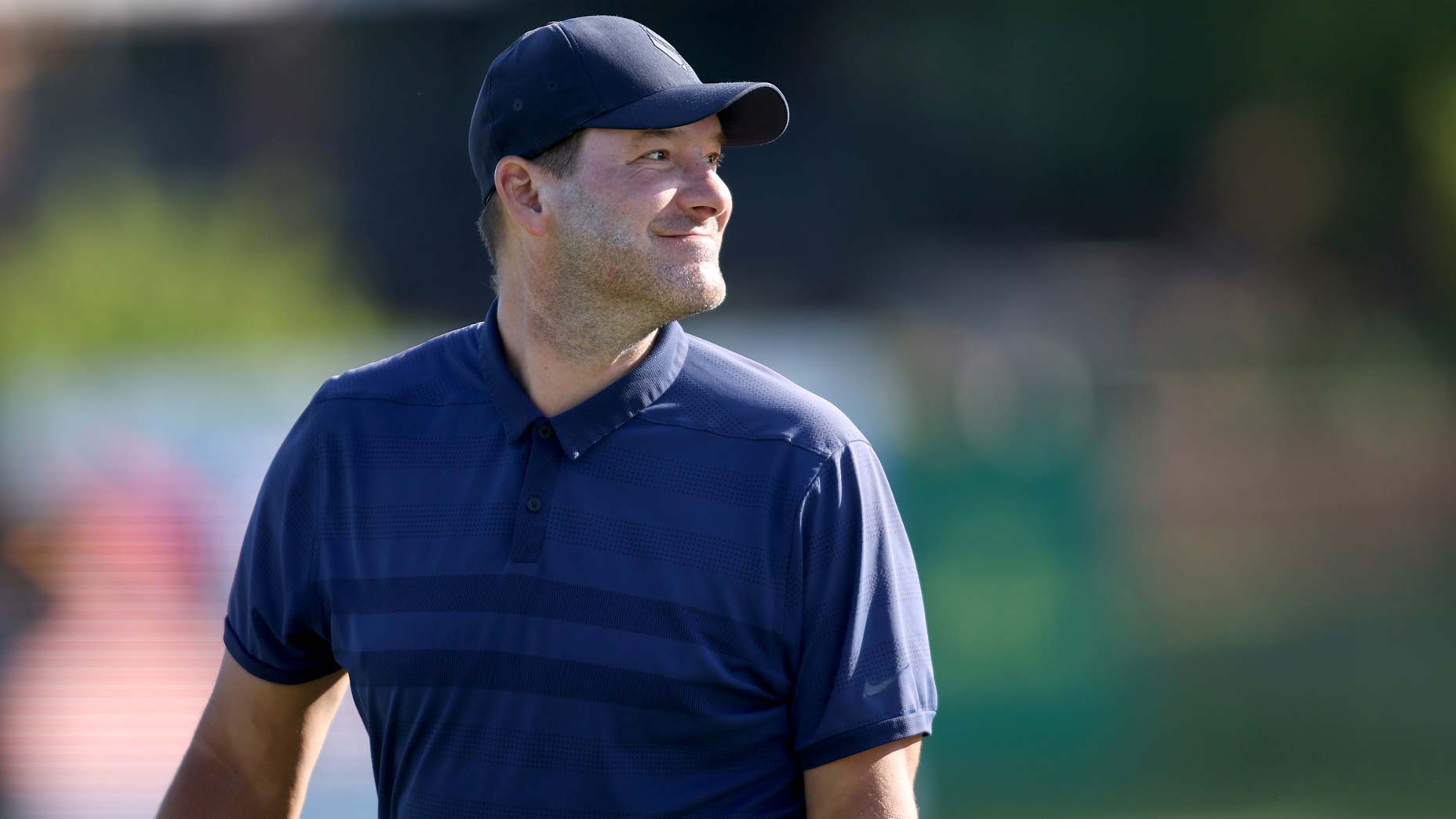 Tony Romo looks on during the Invited Celebrity Classic.