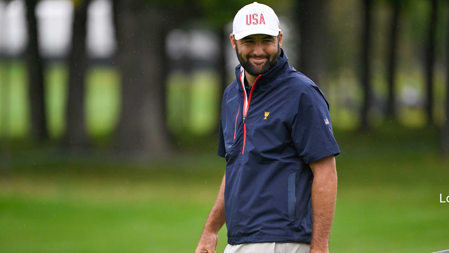 scottie scheffler smiles in team u.s.a. gear at the presidents cup.