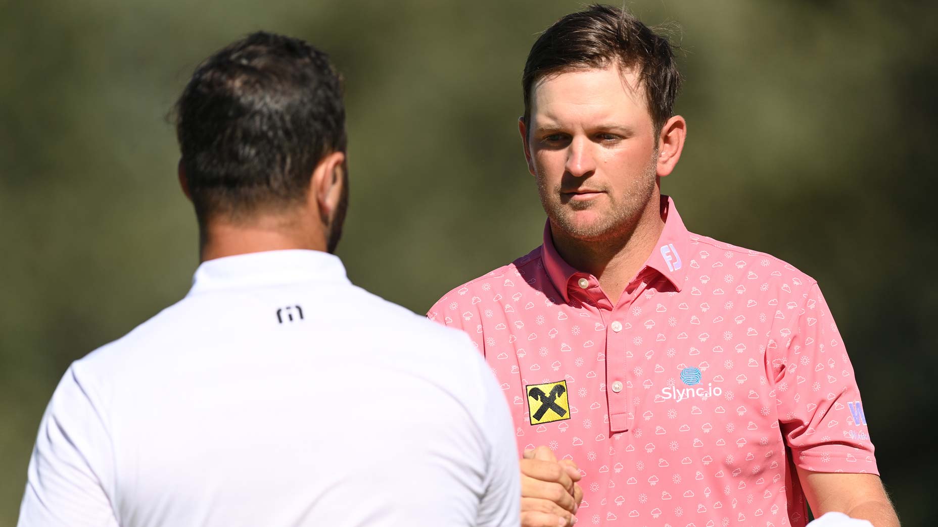 Jon Rahm and Bernd Wiesberger shake hands on the ninth green during Day One of The 2021 Open de Espana at Club.