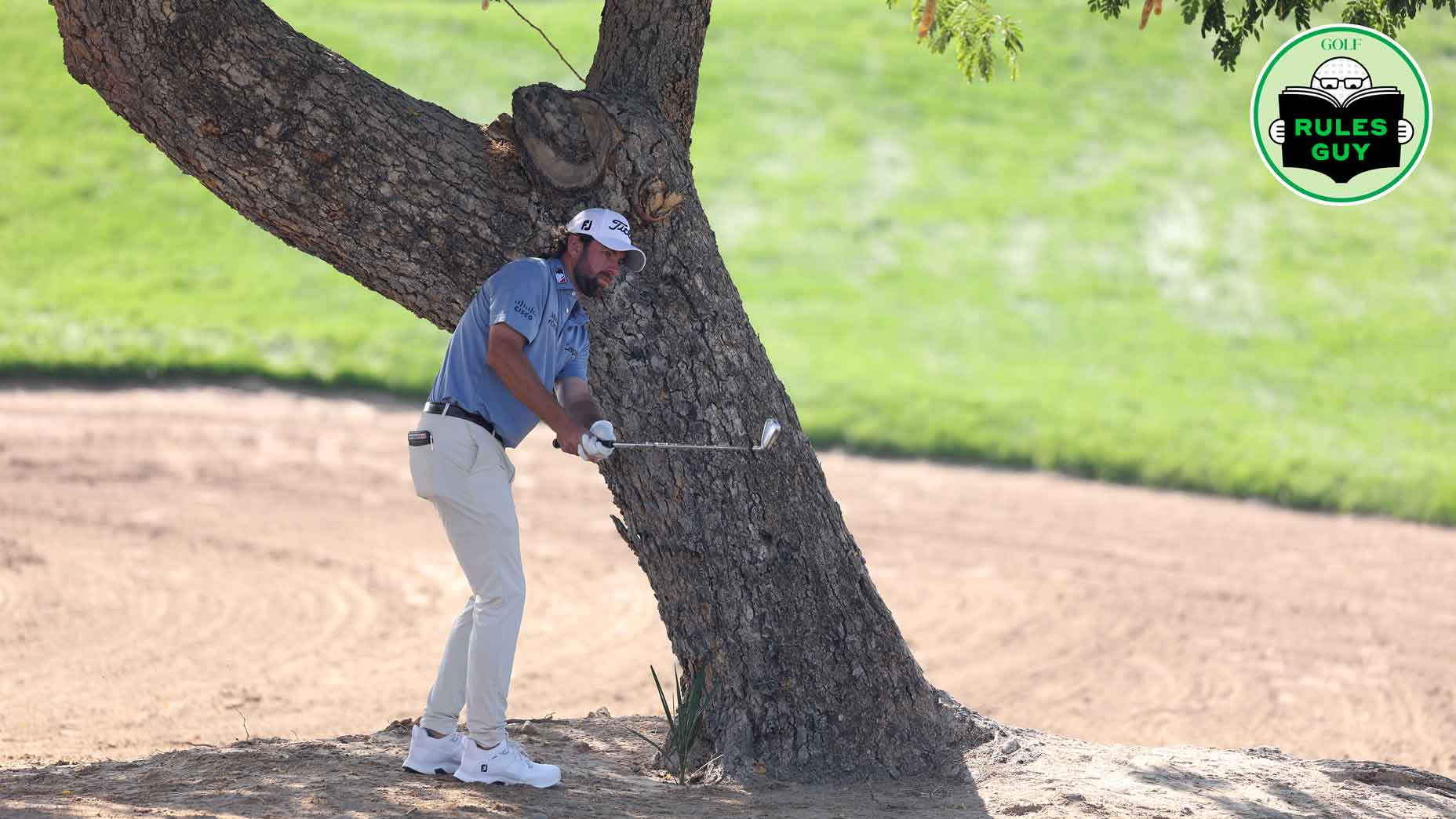 Cameron Young of the United States plays a shot with his left hand from under a tree on the 6th during the final round of the Hero Dubai Desert Classic at Emirates Golf Club on January 21, 2024 in Dubai, United Arab Emirates.