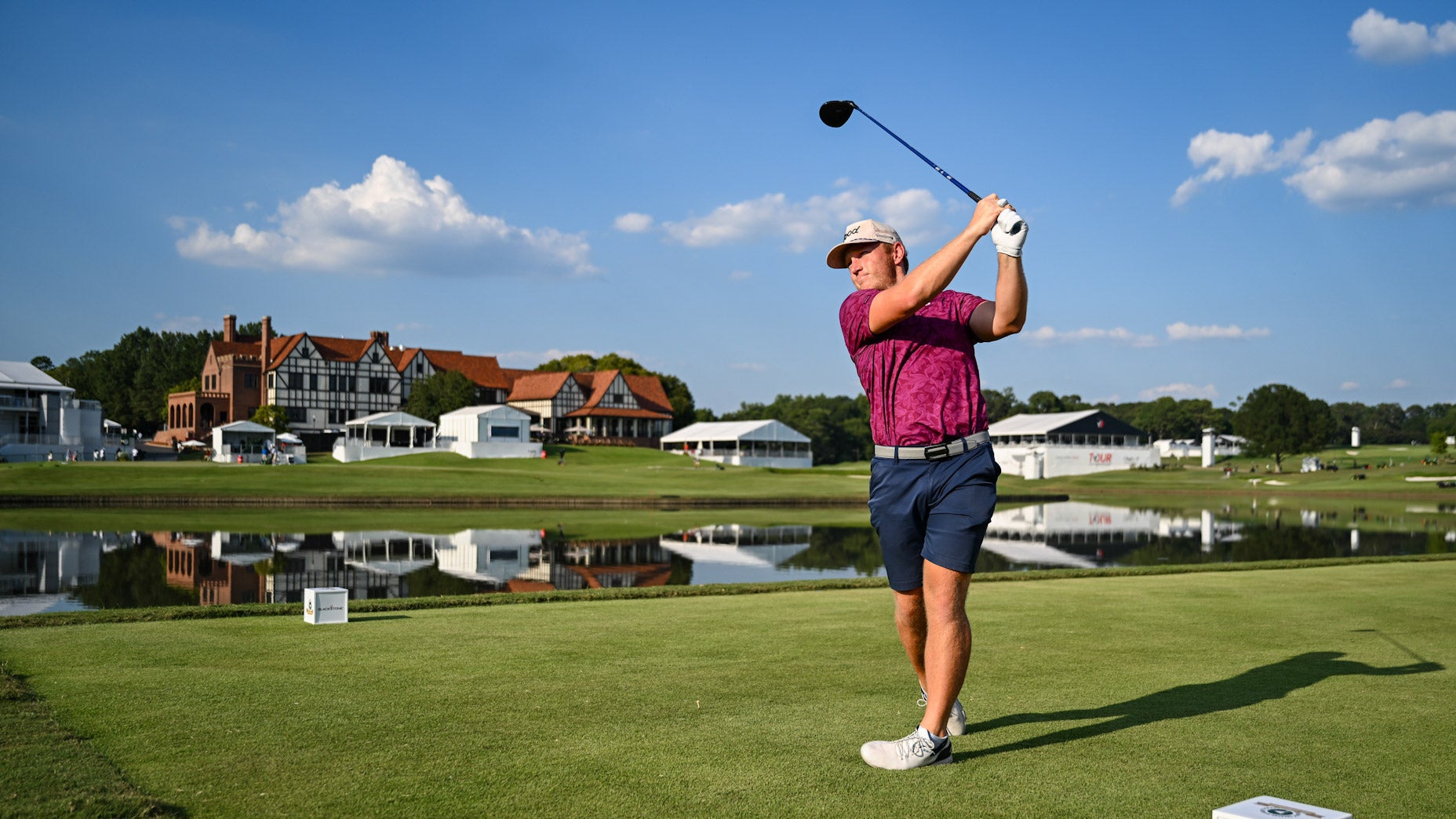 Brad dalke swings club in pink shirt