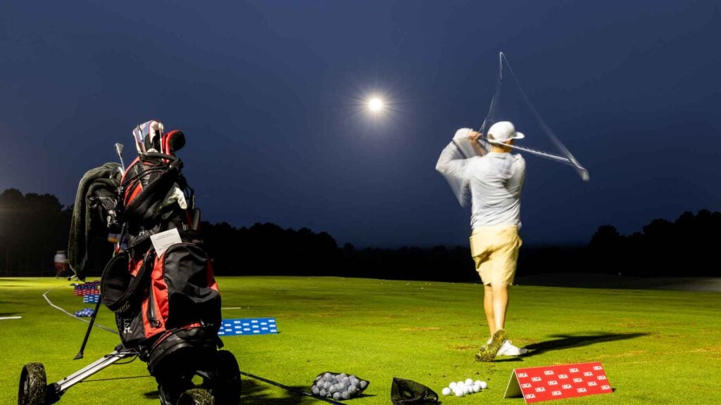 A competitor warming up at the U.S. Mid-Am, on a range illuminated by drones.