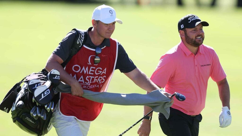 Jordan Smith of England shares a joke with his caddie on the 15th hole on Day Two of the Omega European Masters 2024 at Crans-sur-Sierre Golf Club on September 06, 2024 in Crans-Montana, Switzerland.