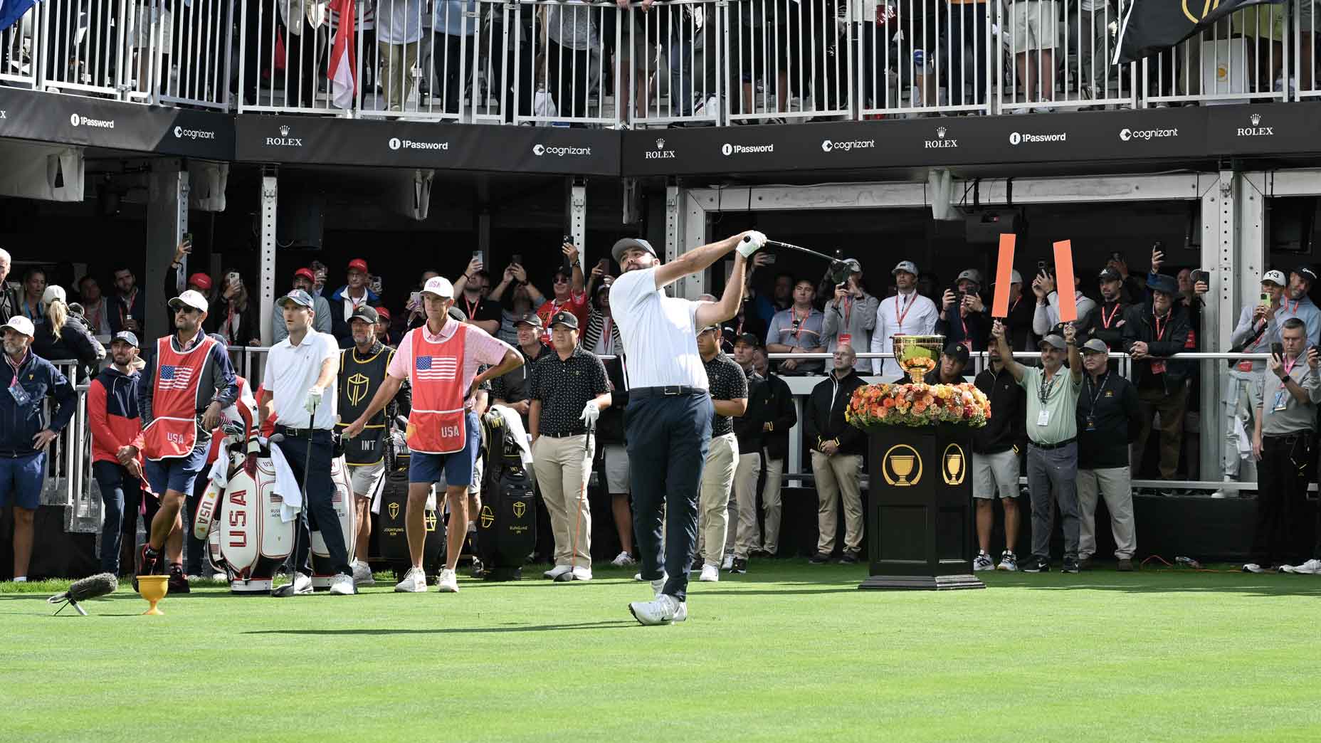 Pro golfer Scottie Scheffler plays his shot from the first tee during Four-Ball on day one of the 2024 Presidents Cup at The Royal Montreal Golf Club.