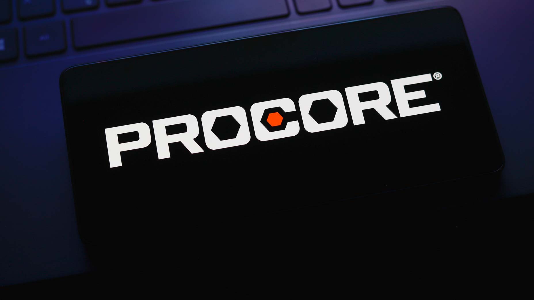 Illustration of the Procore Technologies logo on a smartphone screen.